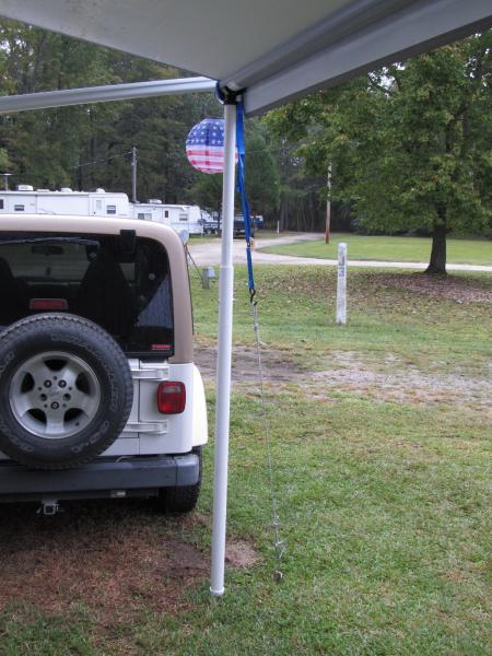 Telescopic posts made from PVC pipe and tie downs for the electric awning