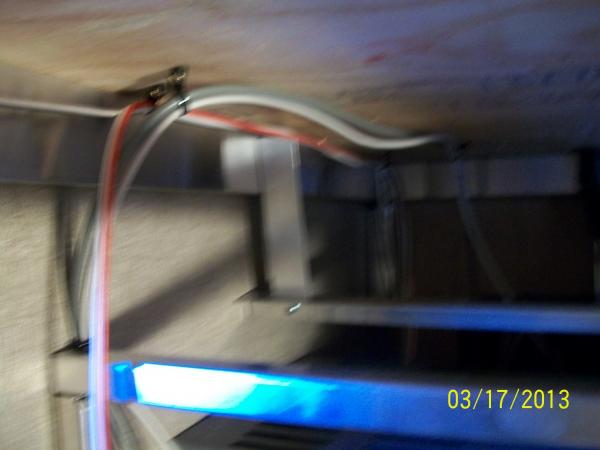 The 110V receptacle wiring, TV Cable, and 12V DC wiring for the compartment light were relocated from the position shown to the left against the wall.