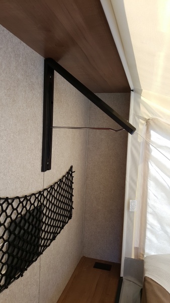 The collapsible closet rod open.