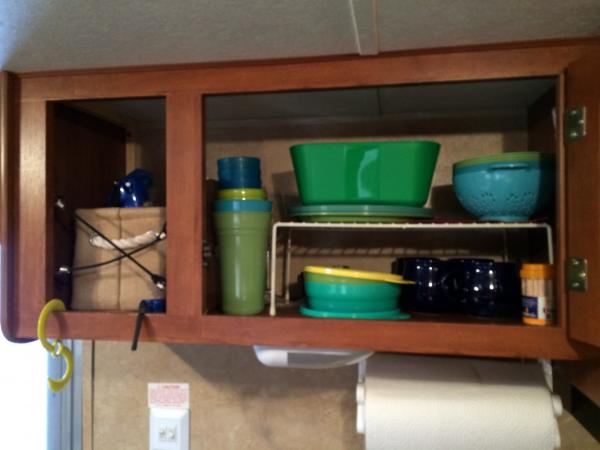 The dish cupboard.  We have a wire Rubbermaid rack to make storage more efficient.  We have the cheap cheap Walmart (do you see a theme? lol) picnic d