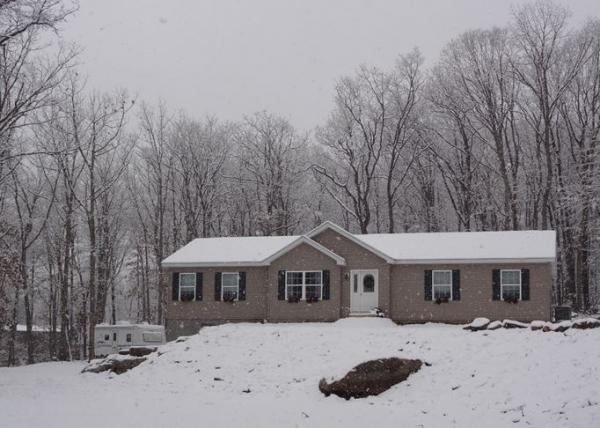 The home base enduring it's first snow on November 26, 2014.  The Jayco Eagle 266 FBS, a veteran to many winter snows, is seen on the left side of the