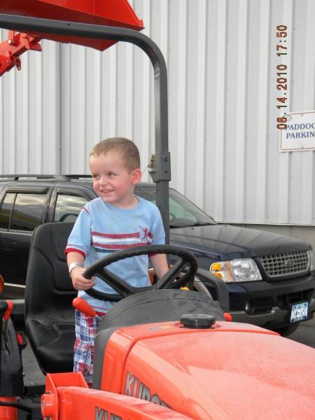 They're never to young to love a tractor; he cried when I took him down; I cried when my wife said I couldn't buy another one.