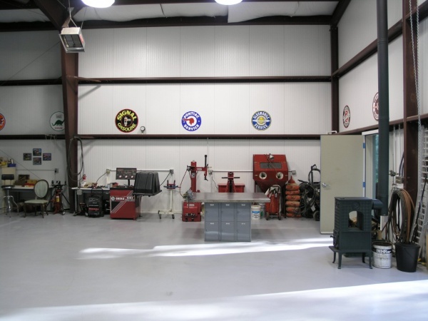 this is a portion of the north wall, showing tire area, bead blasting, and one of the two highly efficient wood stoves made by Jotul of Norway.