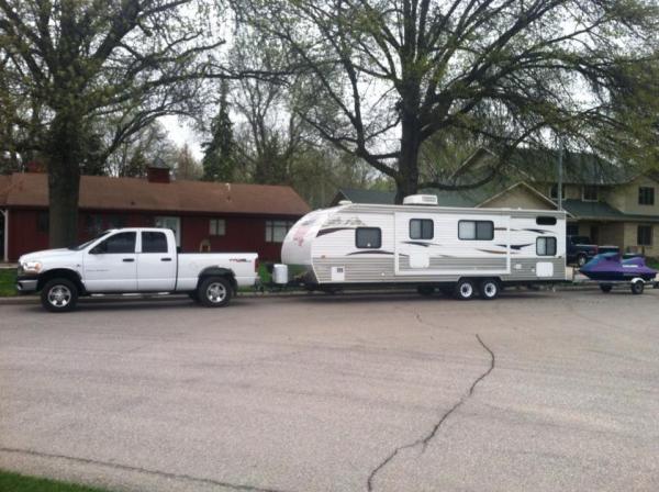 This is Duke, the truck and our previous Camper a 2013 grey wolf Cherokee 26DBH.