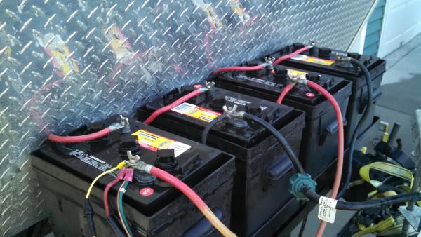 This is my battery bank (4-6 volt golf cart batteries).  

The positive post is closest to us in the picture.  My in-line 1 amp fuse came with a yello