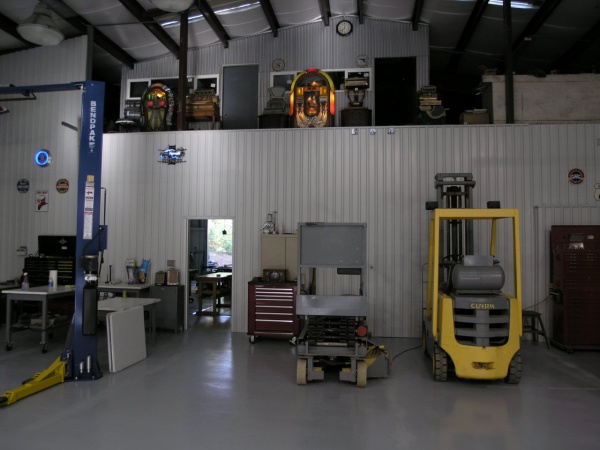 This is the auto shop looking west with mezzanine above the wood shop which is seen through the door. Jukeboxes are 1941 Wurlitzer 850 and a 1948 Wurl