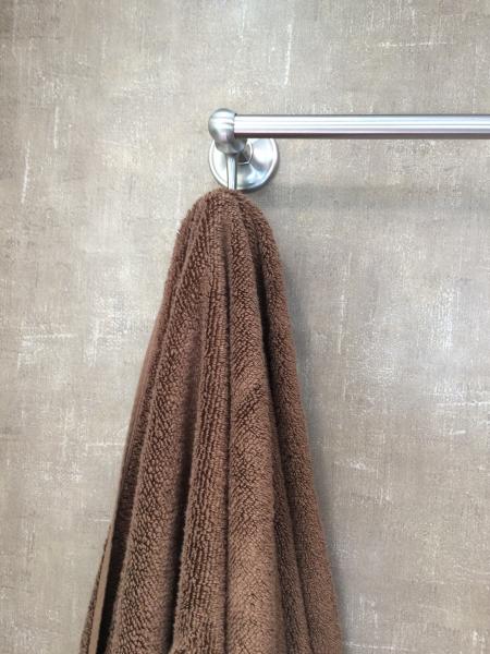 Towel bar also has hooks, comes in handy.