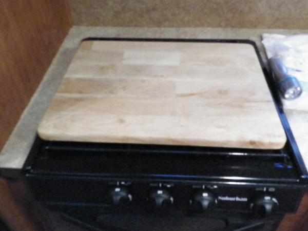 Tv tray made into the stove cover/ extra counter space