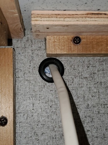 under cabinet hole with grommet