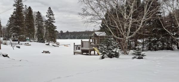 View from parking lot of beach and lake.