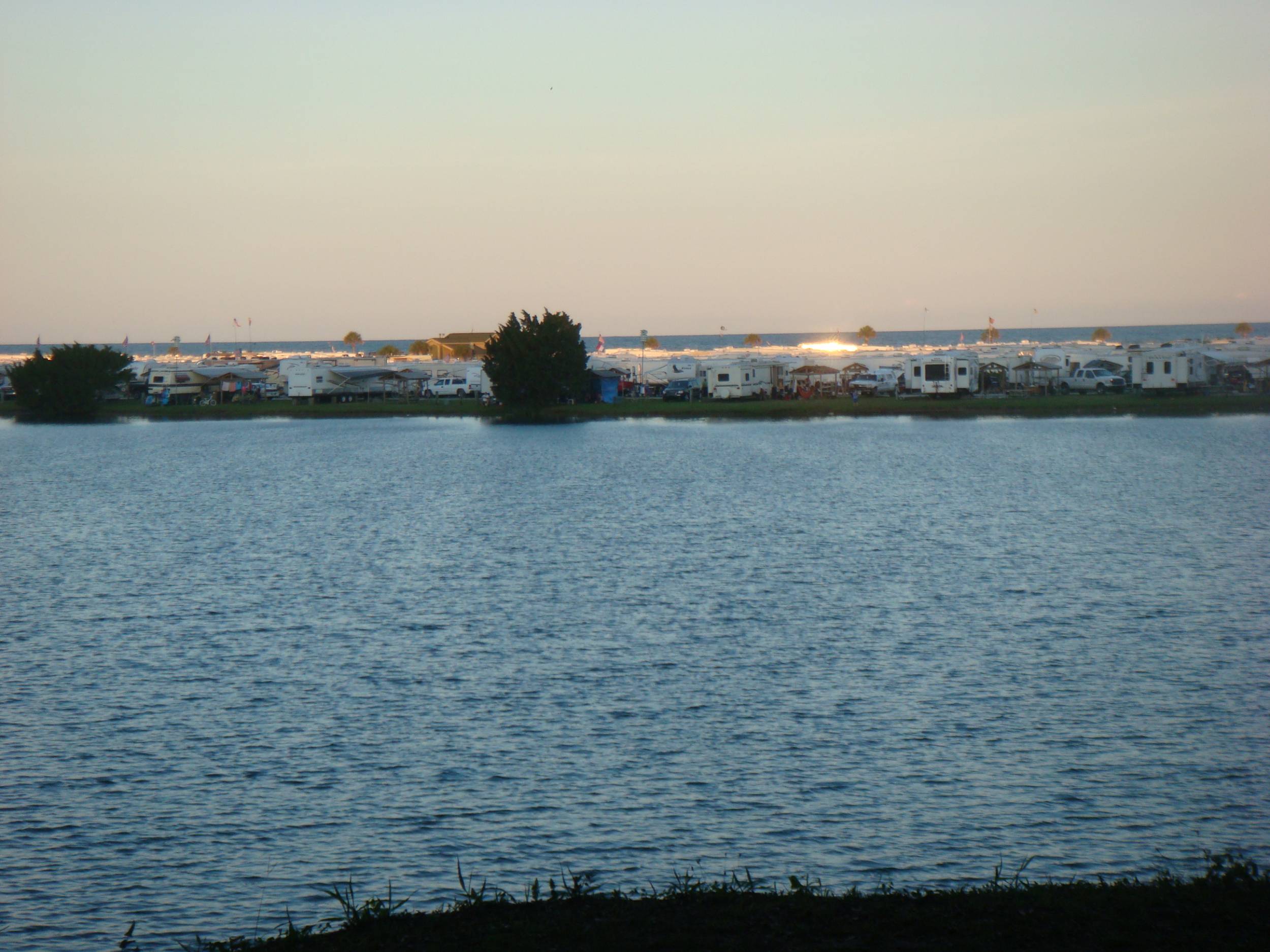 View of the ocean over the lake at Myrtle Beach Travel Park