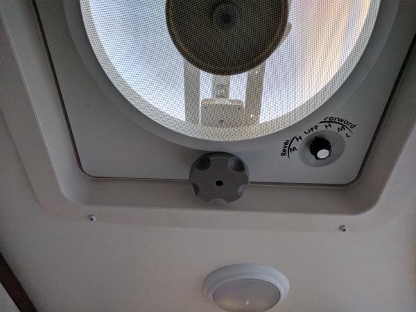 Vortex 2 fan in bathroom. Ran power lines from visable celling light.  Also has a Max air 2 vent cover on the outside.