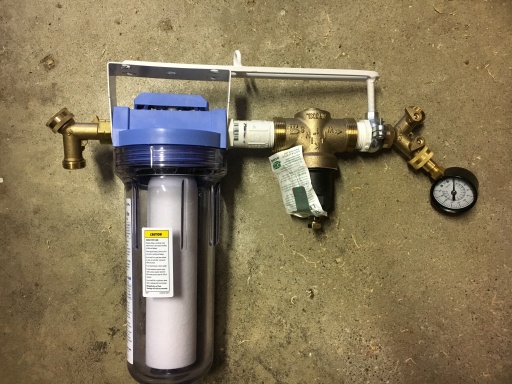 Water filter and regulator assembly.  First Y allows for a hose to be used for washing feet or other purposes.  Y at end allows for pressure gauge to 