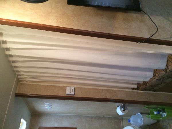 We added a curtain to the bunk.  The fabric is the $1.99/m from Ikea - 60" wide.  I hemmed it short on purpose so a little air could flow through the 