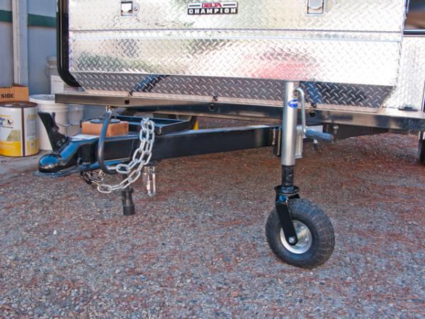 We had a welding shop relocate the tongue jack rearward toward the tool box to allow the RAV4's door to swing across the tongue without hitting anythi