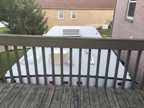 Who needs a ladder to get on the roof of his trailer?  Not this guy.