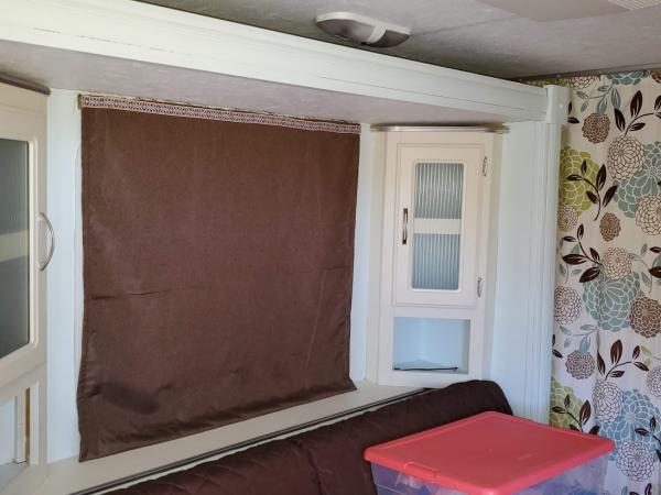 Window Covering.  I removed the valance boxes and made "Roman" Blinds.  They are Insulated and room darkening.  The best part is I bought room darkeni