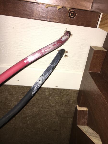 Wires from roof enter through ceiling of street side wardrobe cabinet