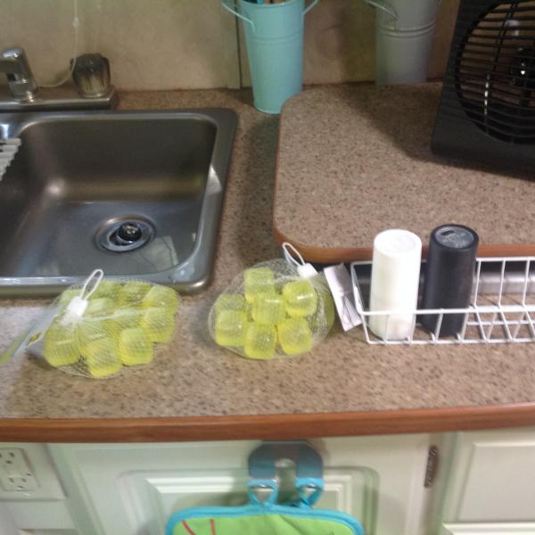 Yellow bagged squares are re-usable ice cubes.  Haven't used yet, but will on next trip.  Bought at Family Dollar.